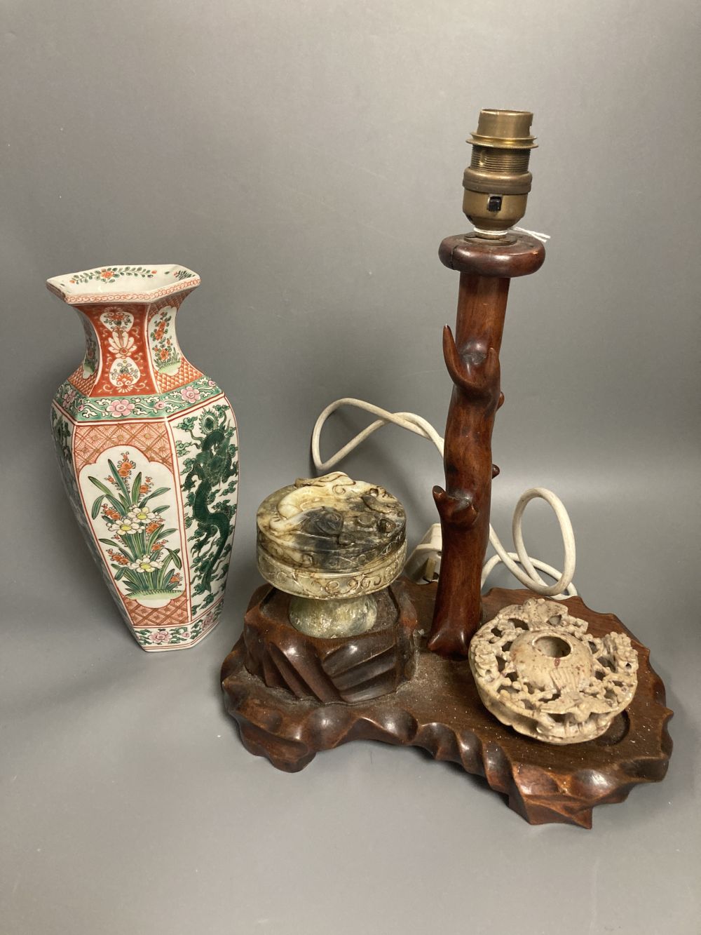 A Chinese hardwood lamp, height 27cm excluding light fitting, two stone carvings and a Japanese vase